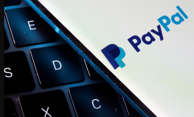 a smartphone with the paypal logo is placed on a laptop in this illustration taken on july 14 2021 photo reuters