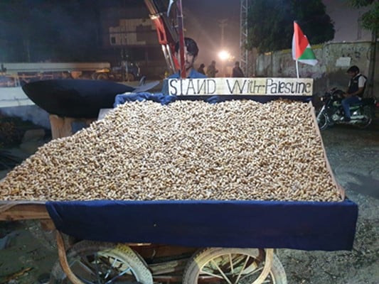 Mohammed Anwar, a peanut vendor standing near Khalid Masjid, Cavalry Ground, Lahore. Photo: Author