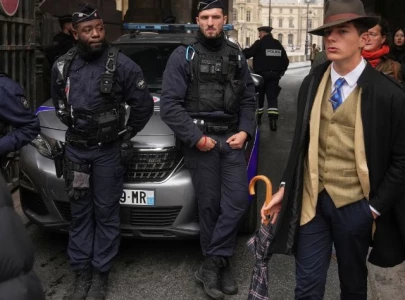 viral fedora man at louvre heist scene identified as 15 year old boy