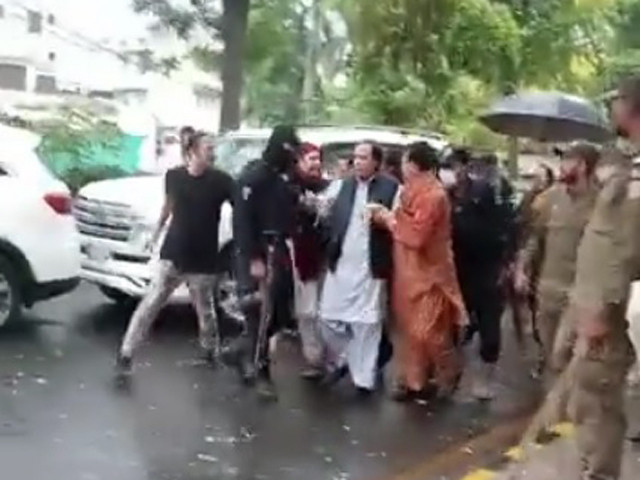 screengrab from video footage shows pti president pervez elahi being arrested from near his lahore residence screengrab from video footage shows pti president pervez elahi being arrested from near his lahore residence