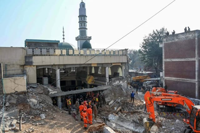 rescue workers search the debris for survivors of peshawar mosque blast on tuesday photo afp rescue workers search the debris for survivors of peshawar mosque blast on tuesday photo afp