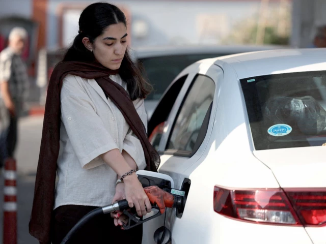 an iranian woman fills her car at a gas station in tehran photo reuters an iranian woman fills her car at a gas station in tehran photo reuters