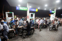 people wait their turn to get fuel at a petrol station in karachi pakistan june 2 2022 picture taken june 2 2022 reuters
