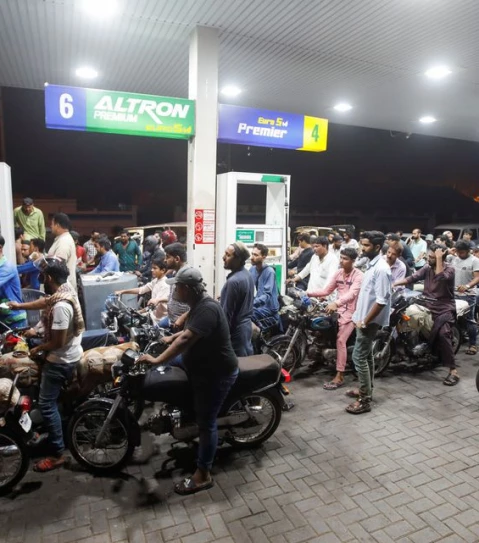 people wait their turn to get fuel at a petrol station in karachi pakistan june 2 2022 picture taken june 2 2022 photo reuters