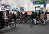 people wait for their turn to get fuel at a petrol station in peshawar on january 30 2023 photo reuters