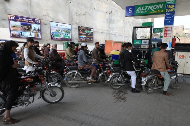 people wait for their turn to get fuel at a petrol station in peshawar january 30 2023 photo reuters file