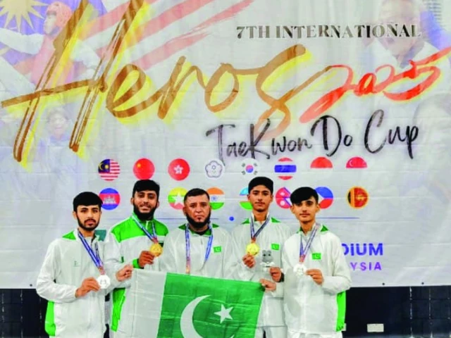 pakistan s ameer hamza muhammad umar shamil ali and hammad sheikh with their coach rahman shah at the hero international takewondo open photo courtesy kta