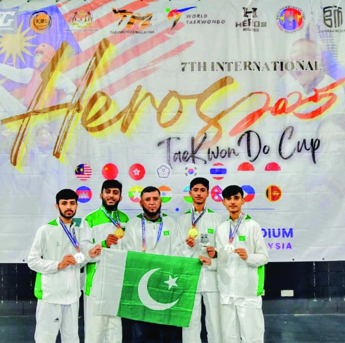 pakistan s ameer hamza muhammad umar shamil ali and hammad sheikh with their coach rahman shah at the hero international takewondo open photo courtesy kta