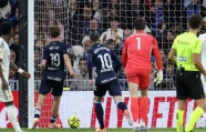 stunned celta vigo s swedish attacker williot swedberg scores his team s second goal in the win over real madrid at the bernabeu photo afp