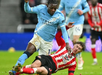 manchester city s title bid dented