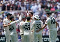 australia s mitchell starc celebrates with teammates after taking the wicket of england s jofra archer photo reuters