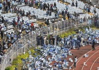 fans threw chairs onto the track of a stadium in kolkata following an appearance of football star lionel messi photo afp fans threw chairs onto the track of a stadium in kolkata following an appearance of football star lionel messi photo afp