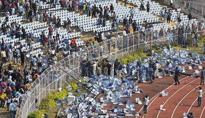 fans threw chairs onto the track of a stadium in kolkata following an appearance of football star lionel messi photo afp fans threw chairs onto the track of a stadium in kolkata following an appearance of football star lionel messi photo afp