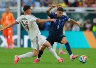uruguay s federico valverde right vies for the ball with spain s aymeric laporte during their world cup group stage match photo afp