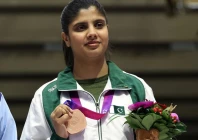 bronze medalist kishmala talat of pakistan attends the awarding ceremony for the women s 10m air rifle of shooting at the 19th asian games in hangzhou photo afp