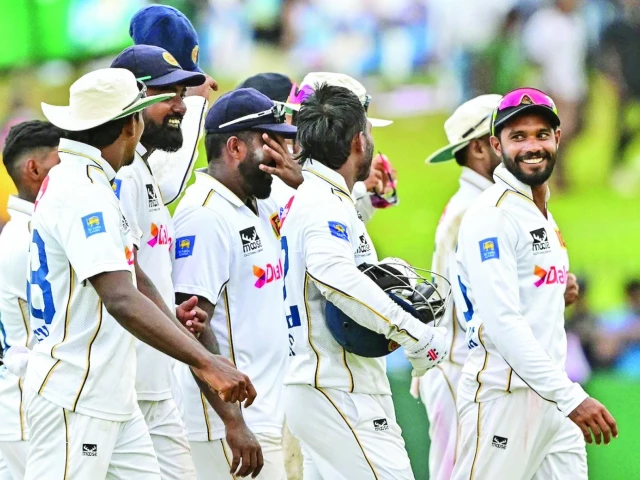 dhananjaya de silva leads his victorious team off the field photo afp dhananjaya de silva leads his victorious team off the field photo afp