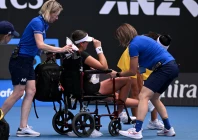 canada s marina stakusic is assisted onto a wheelchair after retiring from her first round match against australia s priscilla hon photo reuters