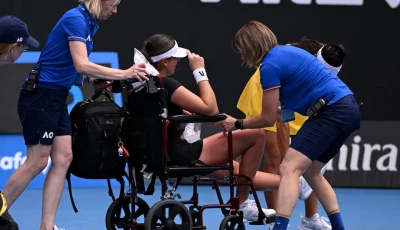 canada s marina stakusic is assisted onto a wheelchair after retiring from her first round match against australia s priscilla hon photo reuters