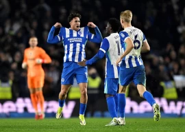 brighton hove albion s charalampos kostoulas celebrates scoring their first goal with carlos baleba and jan paul van hecke photo reuters