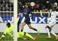 paris saint germain forward bradley barcola c was twice thwarted by auxerre goalkeeper donovan leon l in the first half photo afp