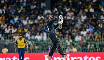 new zealand s captain mitchell santner plays a shot at the world cup photo afp