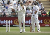 nathan lyon l celebrates the wicket of marques ackerman on the opening day of the first test on tuesday photo afp