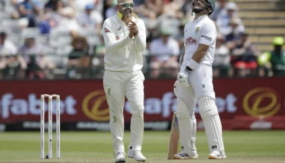 nathan lyon l celebrates the wicket of marques ackerman on the opening day of the first test on tuesday photo afp