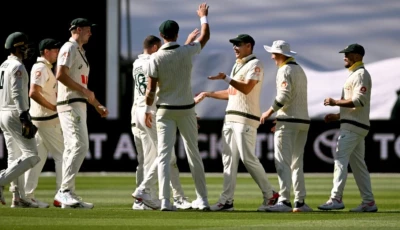 australia s scott boland is congratulated after taking a catch to dismiss england s brydon carse photo afp