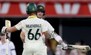 dominating australia cruised to an emphatic eight wicket win over england in the day night second ashes test in brisbane photo afp