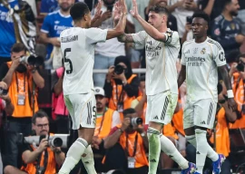 real madrid edged out city rivals atletico madrid in jeddah to set up a spanish super cup final against barcelona on sunday photo afp