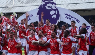 arsenal captain martin odegaard lifts the premier league trophy photo afp