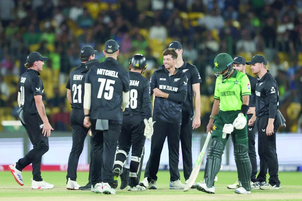 new zealand captain mitchell santner and teammates celebrate the wicket of babar azam photo icc