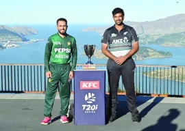 pakistan s mohammad haris l and new zealand s ish sodhi r pose with the series trophy photo cricket new zealand