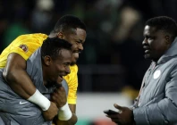 nigeria reserve goalkeeper amas obasogien carries stanley nwabali who saved two penalties in a shoot out victory over egypt in the africa cup of nations third place play off photo afp