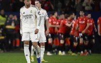 leaders real madrid stung at osasuna