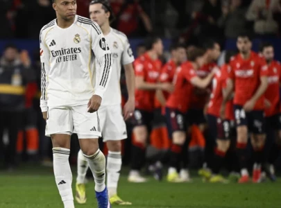 leaders real madrid stung at osasuna