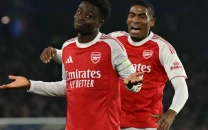 arsenal extend lead in title race after saka sinks brighton