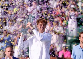 world number two jannik sinner is celebrating with the indian wells trophy photo afp