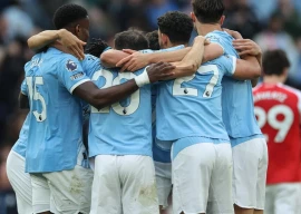manchester city players celebrate their 2 1 win against arsenal at the etihad photo afp