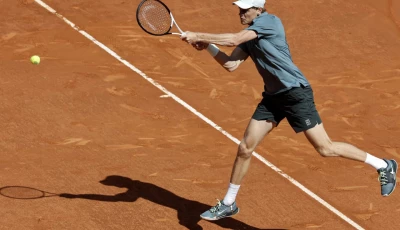 italy s jannik sinner returns a ball to france s arthur fils during the madrid open semi final clash on friday at the caja magica photo afp