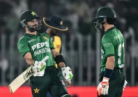 captain sahibzada farhan and maaz sadaqat share a 92 run stand against sri lanka at rawalpindi cricket stadium on friday photo afp