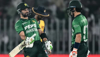 captain sahibzada farhan and maaz sadaqat share a 92 run stand against sri lanka at rawalpindi cricket stadium on friday photo afp