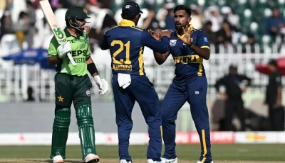 sri lanka s eshan malinga r celebrates with his teammate kamindu mendis the key wicket of babar azam in the first match of the odi tri series at rawalpindi on october 18 photo afp