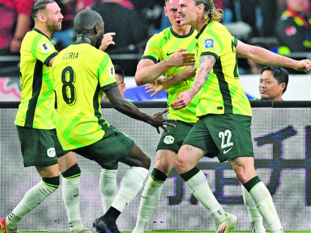 australia s jackson irvine right celebrates with teammates after scoring against china in hangzhou photo afp