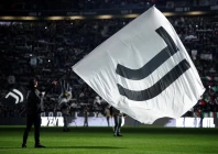 a juventus flag is waved inside the stadium before the match photo reuters a juventus flag is waved inside the stadium before the match photo reuters