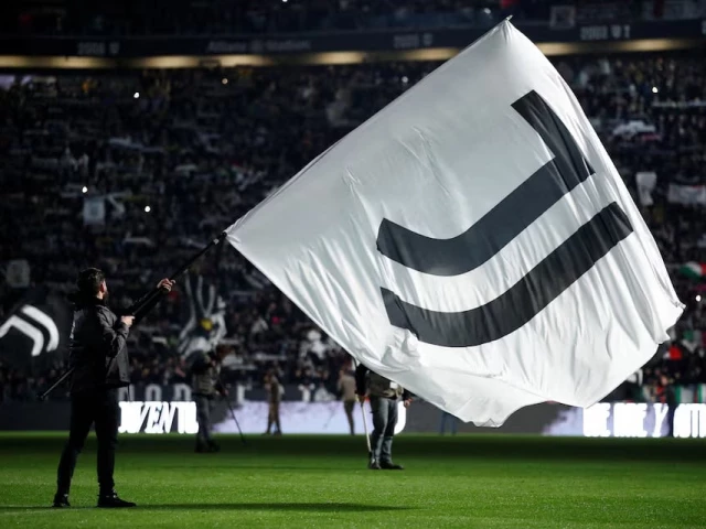 a juventus flag is waved inside the stadium before the match photo reuters a juventus flag is waved inside the stadium before the match photo reuters