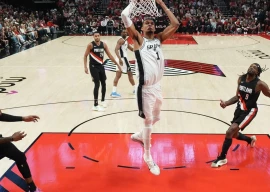 san antonio s victor wembanyama throws down a dunk in the spurs victory over the portland trail blazers in game four of their nba playoff series photo afp