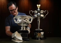 darren may general manager at w j sanders poses with the australian open 2026 norman brookes challenge cup and daphne akhurst memorial cup in sydney australia photo reuters