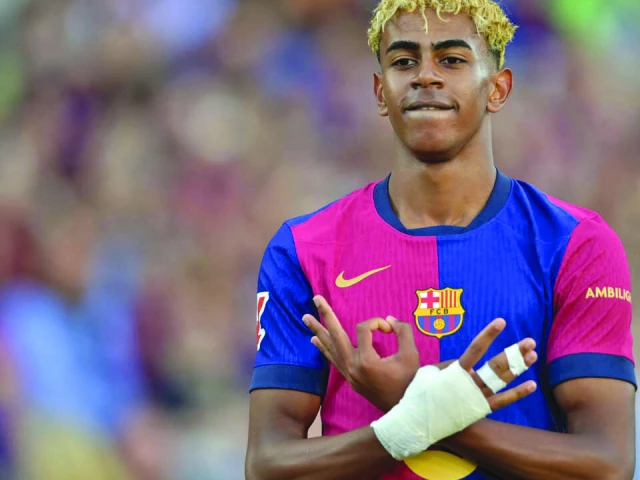barcelona s spanish forward lamine yamal has penned a new deal with the catalan giants after a superb season photo afp