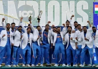 general view as india players celebrate with the trophy on the podium after winning the icc men s champions trophy photo reuters